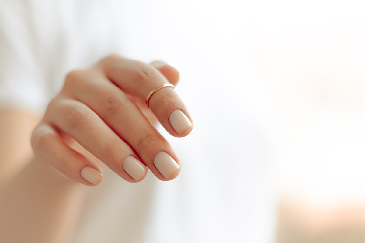 Natural nude gel manicure with short healthy nails, the signature Japanese salon style